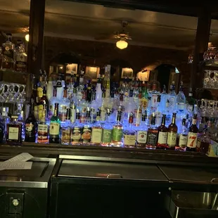 a bar filled with liquor bottles