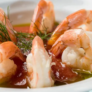 a bowl of shrimp and tomato soup