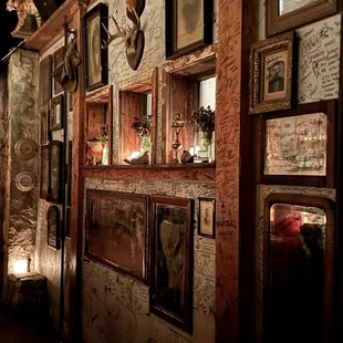 a room with a lot of pictures on the wall