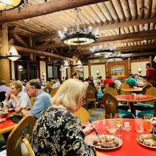 people sitting at tables eating