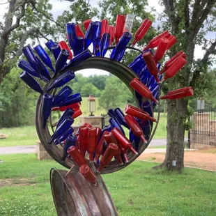 red, white, and blue bottles arranged in a circle