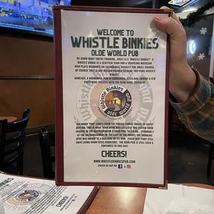 a man holding up a sign