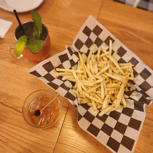 a basket of fries and a drink