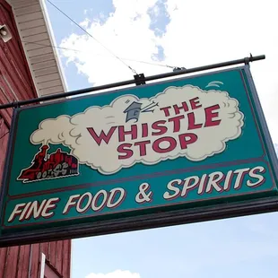 a sign for a fine food and spirits restaurant
