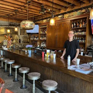 a man standing at the bar
