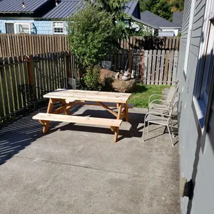 One of two picnic tables out back.