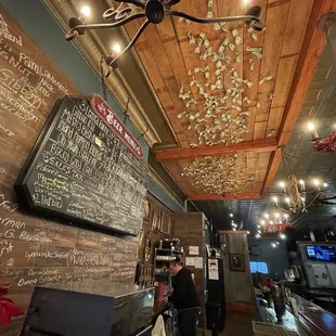 Inside. How the heck does anyone get a dollar to stick way up there?