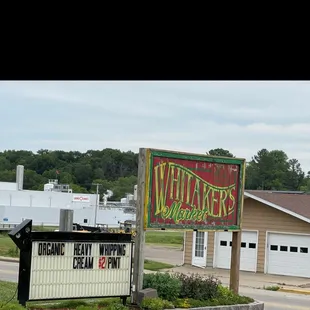 a sign in front of a building
