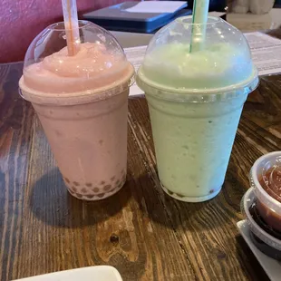 Strawberry (pink) and honey dew melon (green) bubble teas