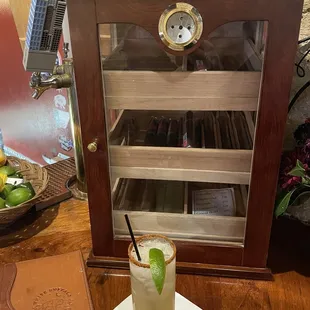 The Spicy Cowgirl in front of the humidor