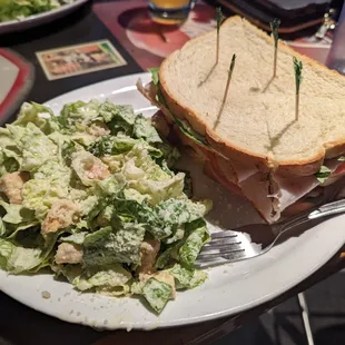 Clubhouse Sandwich for $11 + $3 up-charge for Caesar Salad.