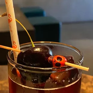 a drink with cherries in it