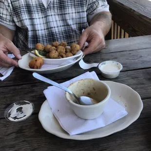 The empty gumbo cup and the mushroom appetizers