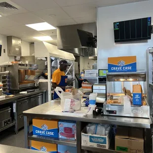 a man working in a commercial kitchen