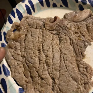 T-bone steak that's grey, steamed and not seasoned. It's so thin and nasty the texture is off