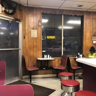 a diner with red stools