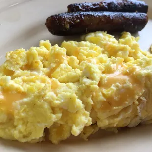 Scrambled eggs with cheese and sausage