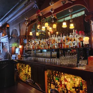 a bar with many bottles of alcohol