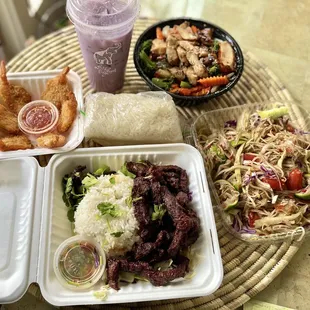 Coconut shrimp, waterfall beef (jerky version), Lao style papaya salad, sticky rice, lemongrass chicken rice bowl, and ube coconut milk.