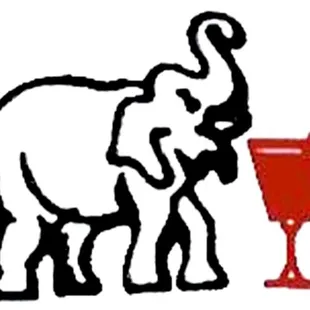 an elephant and a red wine glass