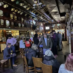 a crowd of people sitting at tables