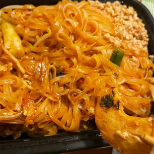 bitter charred pieces of meat and noodles