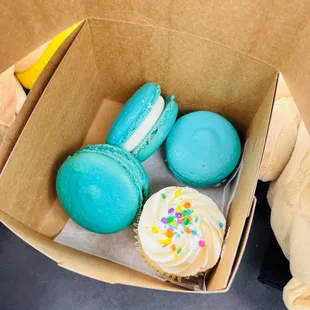 a cupcake and macarons