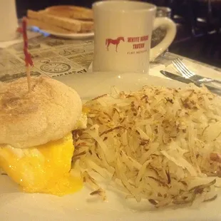 Double Egg Breakfast Sandwich with Cheese and a side of Hash Browns.