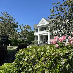 Front of property, with beautiful gardens