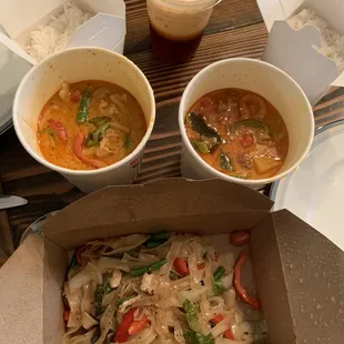 Red curry left, duck curry right, hangover noodles with chicken bottom. Thai iced tea top.