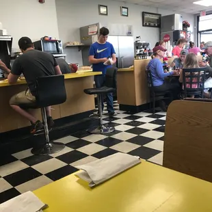 Dining area and grill behind counter