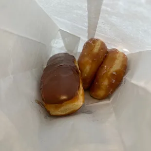 two chocolate covered doughnuts