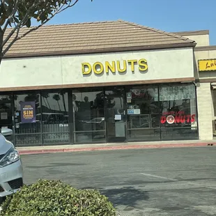 a car parked in front of a donut shop