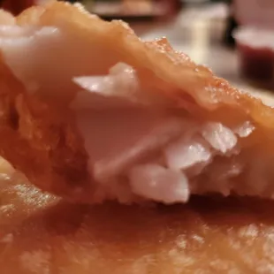 a close up of a doughnut with a bite taken out of it