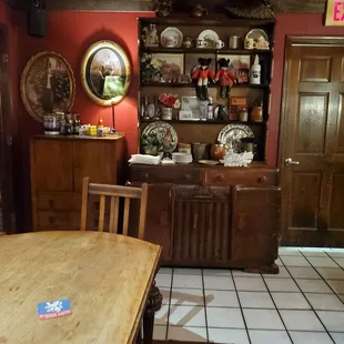 a dining room with red walls
