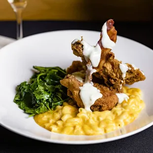 Marina&apos;s Fried Chicken 
Half Chicken · Original Cheesy Mac · Sautéed Kale·  
Pecan Smoked Bacon Bits · Gravy