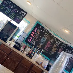 a chalkboard with a price list on it