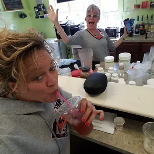 a woman drinking a drink