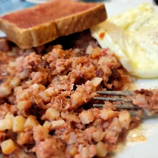 Corned beef hash, eggs Sunnyside up and toast