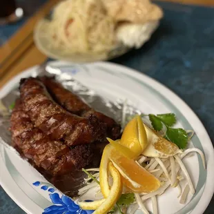 a plate of meat and vegetables