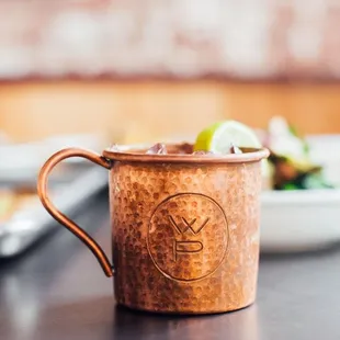 a moscow mule with a lime slice in it