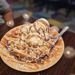 Waffle with ice cream, caramel and fudge