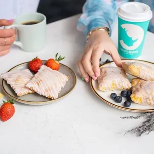 two plates of food and a cup of coffee