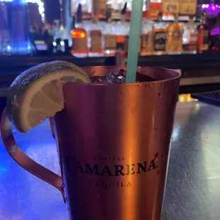 a copper mug with a lime slice in it