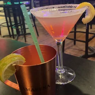 a cocktail in a copper mug with a lime slice on the rim