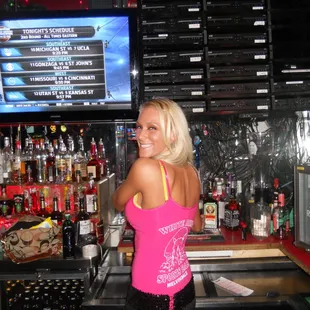 a woman behind the bar