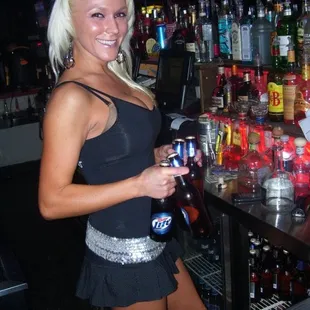 a woman holding a beer