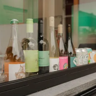 bottles of wine on a window sill