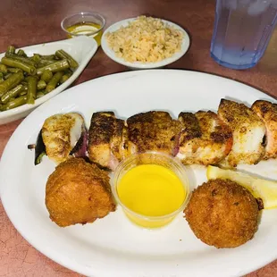 Fish kebab green beans and spicy rice