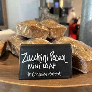 a sign that says zucchini pecan mini loaf contains nuts